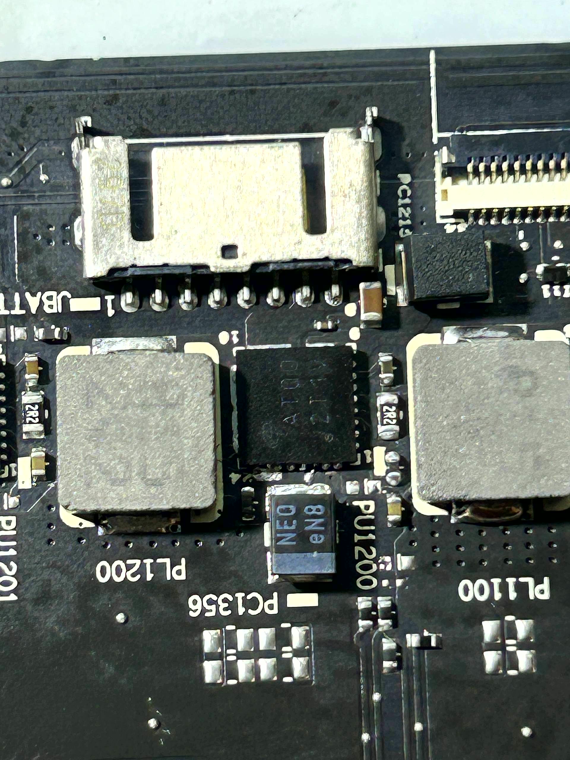 Same laptop motherboard after vSource chip-level repair · fully restored