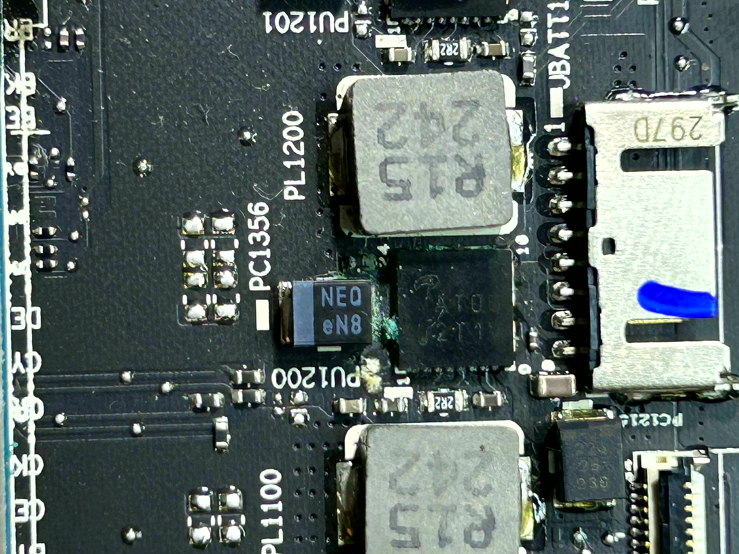 Laptop motherboard before component repair · dirty contacts and worn parts