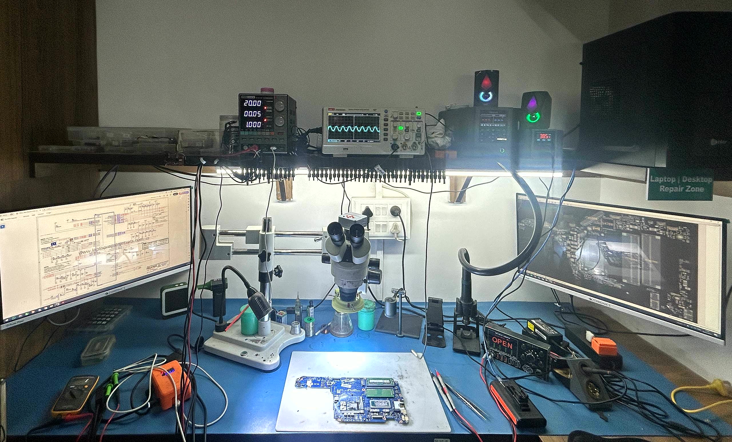 vSource chip-level repair workshop in Lohegaon Pune · BGA rework station, microscope, oscilloscope and dual monitors with circuit diagrams