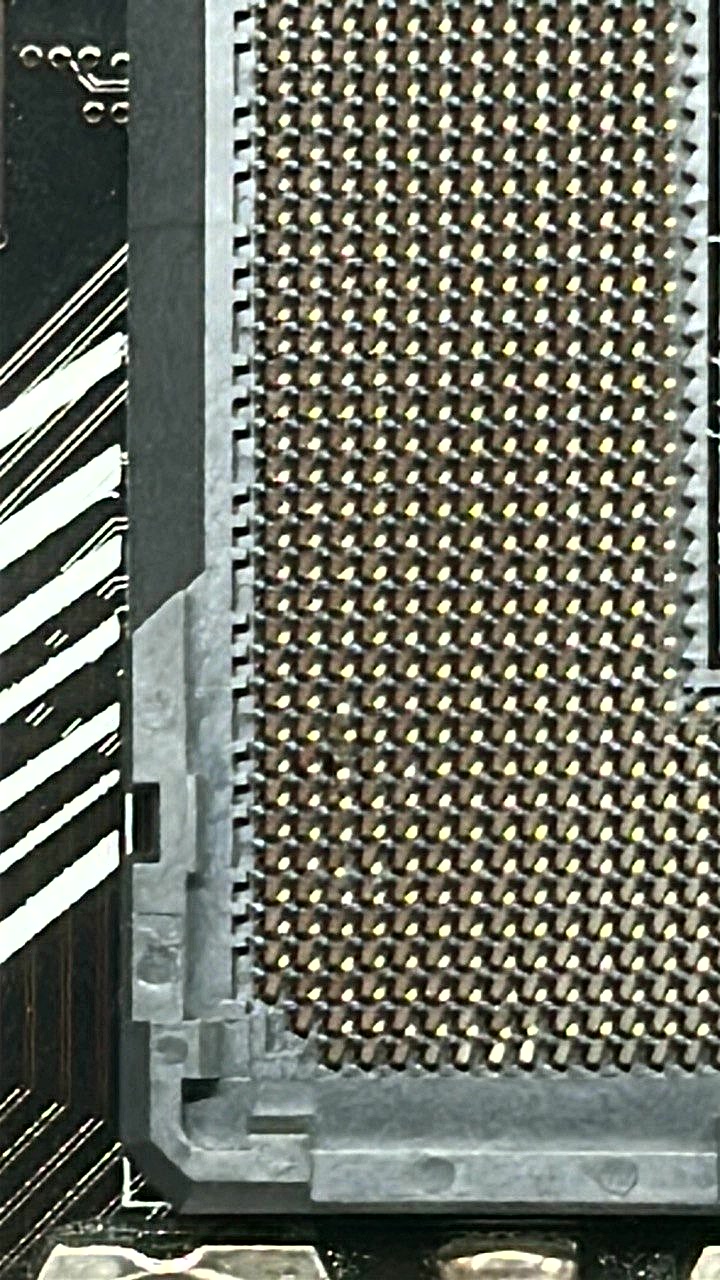 Same LGA socket after vSource pin straightening · all pins aligned and CPU detected